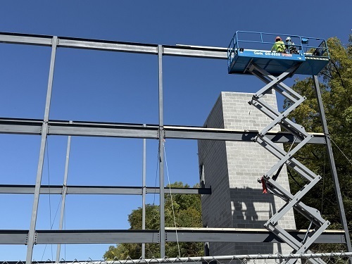 Construction crew atop the scaffolding
